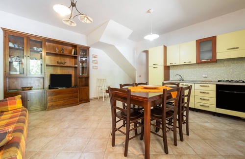 Porto Pino House | Holiday Home 'Casa Martini' with Private Terrace, Private Garden and Air Conditioning
