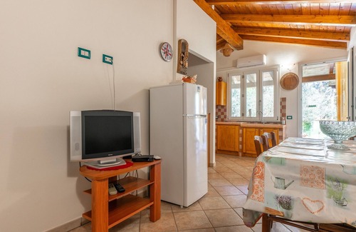 Porto Pino House | Holiday Home 'Villetta Ghisu' with Private Terrace, Private Garden and Air Conditioning