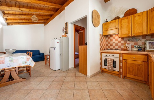 Porto Pino House | Holiday Home 'Villetta Ghisu' with Private Terrace, Private Garden and Air Conditioning