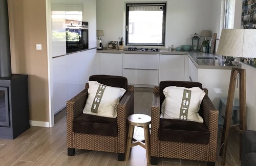 Indijk House | Holiday house on water, recently furnished, new Siematic kitchen, event incl sloop