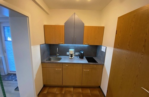 Zueschen Apartment | Holiday studio with two single beds and a sun terrace in the mountains