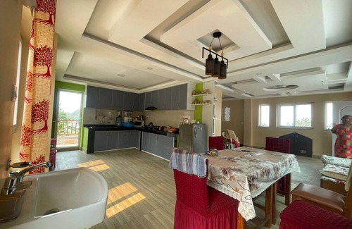 Kirtipur House | Home is located on the side of a mountain near a famous Buddhist monastery. n