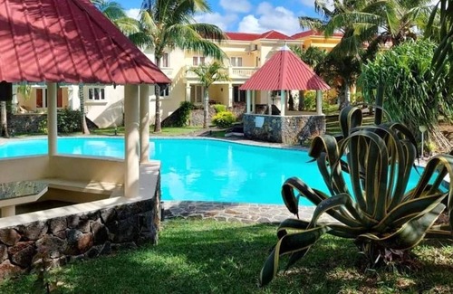 Palmar House | Homerez - Bungalow for 6 ppl. with shared pool, sea view and terrace at Palmar