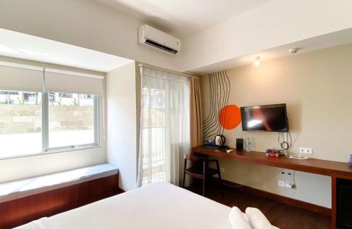 Duren Sawit Apartment | Homey Studio No Kitchen at Gateway Park LRT City Jatibening Apartment By Travelio