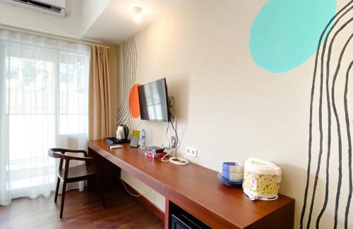 Duren Sawit Apartment | Homey Studio No Kitchen at Gateway Park LRT City Jatibening Apartment By Travelio
