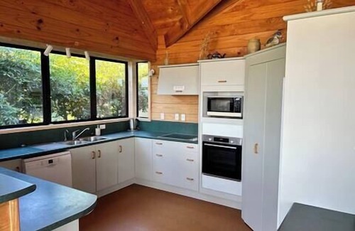 Matarangi House | Hosts on the Coast shimmering on the Shore