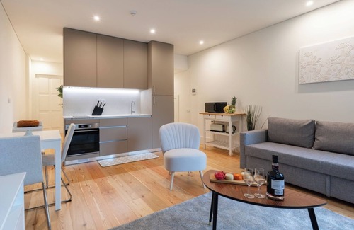 Guimaraes Apartment | HostWise - Sunny Flat w/Balcony