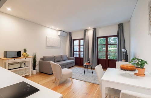 Guimaraes Apartment | HostWise - Sunny Flat w/Balcony