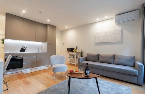 Guimaraes Apartment | HostWise - Sunny Flat w/Balcony