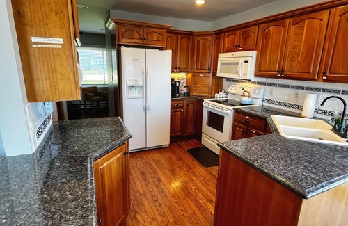 Wolf Lake House | Huge beach house! Kayaks, fire pit, game room! Gentle Sandy slope, Crystal clear