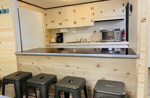 Wolf Lake House | Huge beach house! Kayaks, fire pit, game room! Gentle Sandy slope, Crystal clear