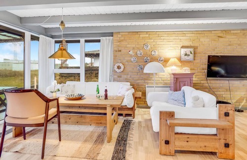Strandby House | In the 1st row of dunes and with sea view to the Kattegat, this bright and cozy vacation home in Str
