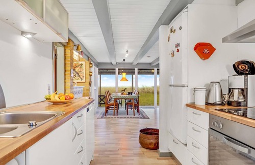Strandby House | In the 1st row of dunes and with sea view to the Kattegat, this bright and cozy vacation home in Str