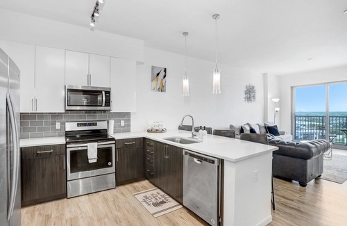 Channel District Apartment | Includes access to top of the line Gym, Luxary Pool, & City View Sky Lounge