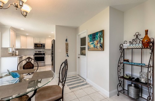 Micco House | Indian River Waterfront Home with private dock, heated pool, fenced back yard