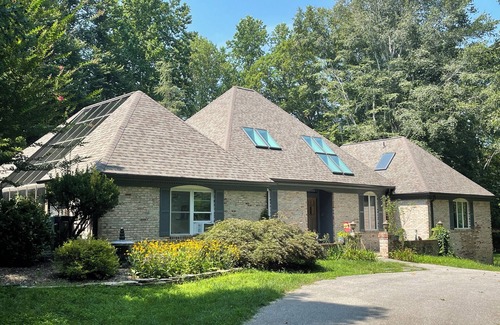 Chesapeake Beach House | Indoor pool and spa in contemporary French home secluded in surrounding woods