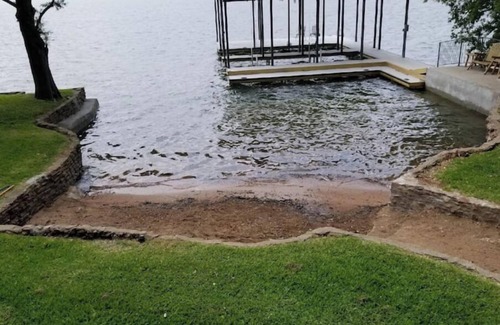 Buchanan Dam House | Inks Lake Vacation Home with wonderful water location. Beach & dock.