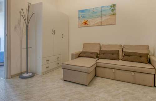 Lido Adriano Apartment | Inviting apartment with shared terrace and direct path to the sea.