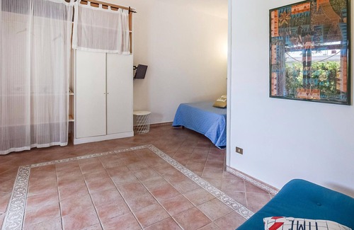 Sant'Angelo House | Inviting cottage with charming outdoor area and limited sea view.
