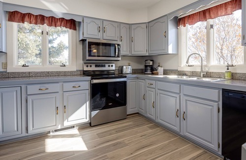 Jackson Hole House | Inviting home with mountain view, fireplace, golf nearby, & washer/dryer