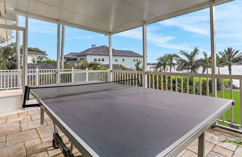 Carrollwood House | Inviting lakefront home with dock, kayaks, hot tub, pool, firepit, & W/D