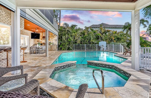 Carrollwood House | Inviting lakefront home with dock, kayaks, hot tub, pool, firepit, & W/D