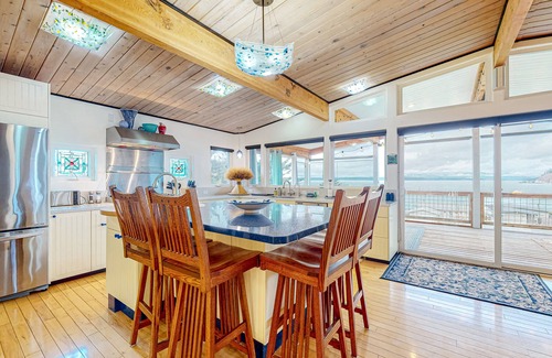 Clinton House | Inviting Puget Sound view home with beach access, fire table, hot tub, & W/D