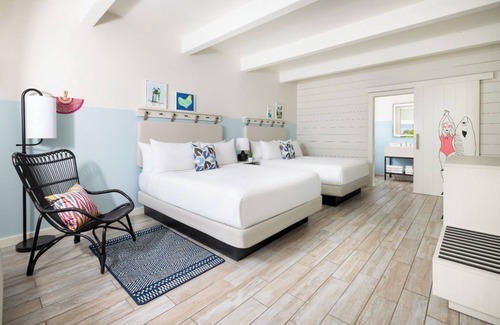 New Town Hotel | Island Charm & Retro Fun | Pools, Comfort Eats, Shuttle & Fire Pits