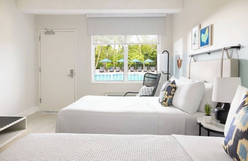New Town Hotel | Island Charm & Retro Fun | Pools, Comfort Eats, Shuttle & Fire Pits