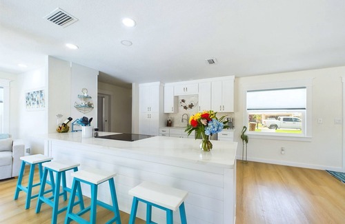 Surfside Estates House | Island Oasis with Heated Pool, Putt Putt Course, Tiki Bar, and Beach Gear!