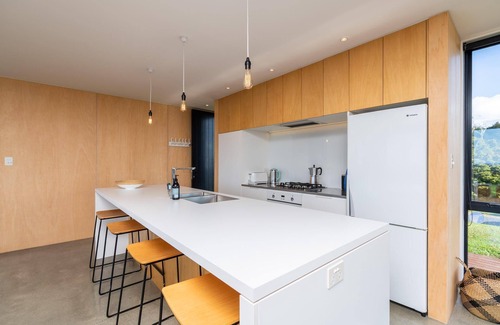 Mangawhai House | Island View - Designer holiday home with fabulous indoor outdoor living and spectacular views