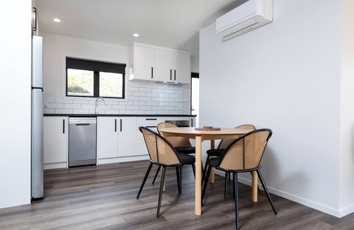 New Plymouth House | Kick back and relax in this calm, stylish space.