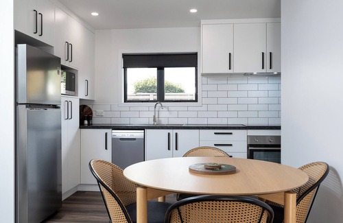 New Plymouth House | Kick back and relax in this calm, stylish space.