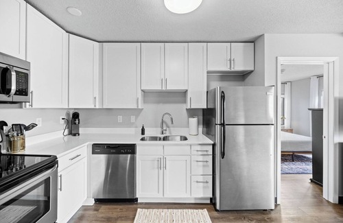 Historic East Village Apartment | King Bed | Onsite Gym | Downtown Views | Parking