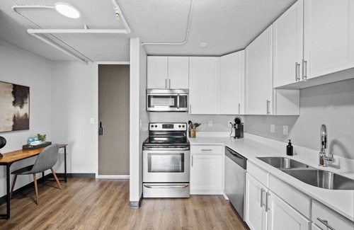 Historic East Village Apartment | King Bed | Onsite Gym | Downtown Views | Parking
