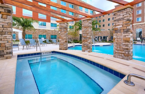 Gainesville Condo | King Suite. Outdoor Pool & Hot Tub. Free Breakfast. 10 Minutes to University of Florida.