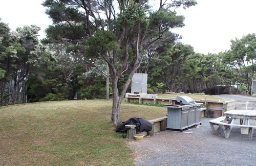 Kawau Island House | Kitchen and entertainment area with views and 3 pods for sleeping all separate