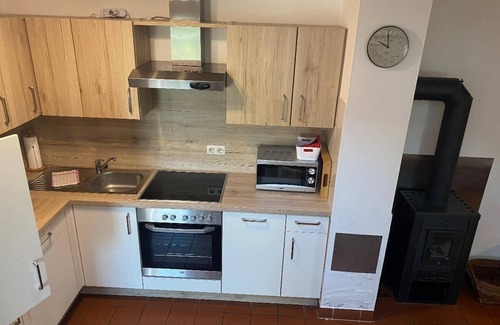 Zandt Apartment | Komplett neu ausgestatteter Ferienbungalow mit Kaminofen und Garten