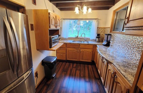 Caroline Cabin | Kozy cabin in the woods with a hot tub and woodstove.