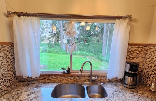 Caroline Cabin | Kozy cabin in the woods with a hot tub and woodstove.