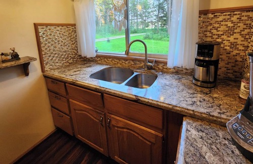 Caroline Cabin | Kozy cabin in the woods with a hot tub and woodstove.