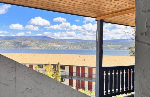 Central Okanagan Condo | Lake condo seconds from the beach. Enjoy the view from the balcony or dockside.