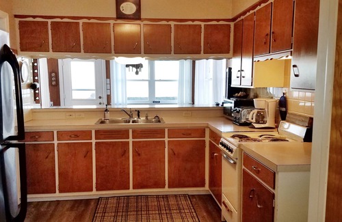 Gypsum House | Lake Front Nautical Themed Home with Private Yard & Sandy Bottom Water Access!