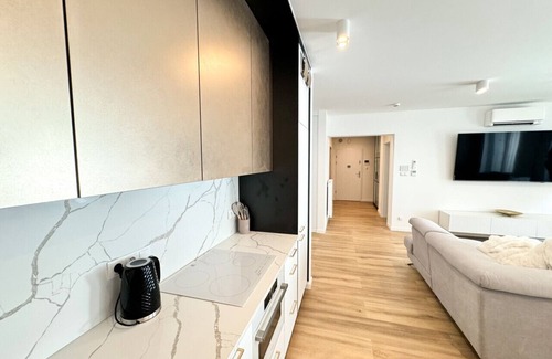 Trzebiatow Apartment | Lake pool view with private beach access Garage
