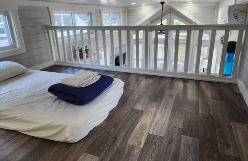 Berryville Cabin | Lake Side Tiny Home, large deck.
