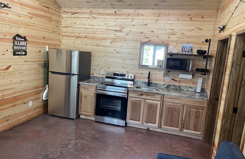 Grove Cabin | Lake view 2 bedroom cabin that sleeps 6. Private deck and fire pit area.
