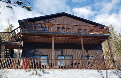 Central Kootenay House | Lake view boho inspired home with heated covered parking