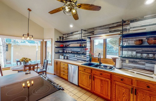 Greeley House | Lake-view home with gas fireplaces, inviting deck & dog-friendly yard