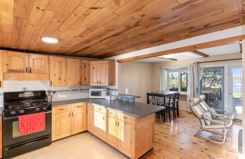 Chestermere Cabin | LAKEFRONT CABIN WITH COVERED DECK, HOT TUB & MORE
