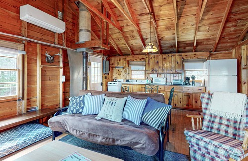 Otis Apartment | Lakefront cabin with deck, grill, screened porch, & firepit - dog-friendly